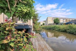 In deze ruime, aan de polder grenzende familiewoning aan de P.J. Oudstraat 14 woon je buiten de stad en toch @Amsterdam Foto 24