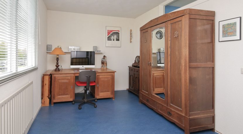 In deze ruime, aan de polder grenzende familiewoning aan de P.J. Oudstraat 14 woon je buiten de stad en toch @Amsterdam Foto 38